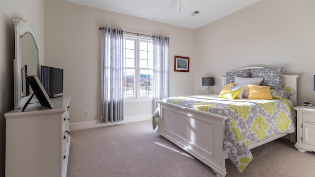 bedroom featuring light carpet and ceiling fan