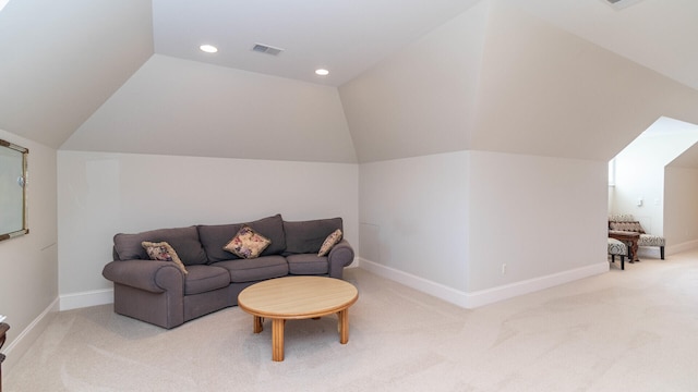 living room with lofted ceiling and carpet flooring