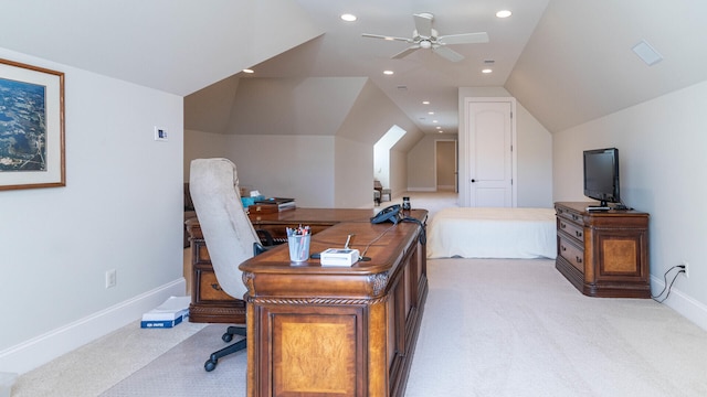 home office featuring vaulted ceiling, light colored carpet, and ceiling fan