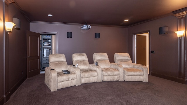 home theater with crown molding and dark carpet