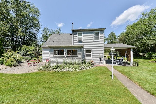 back of house with a yard and a patio area