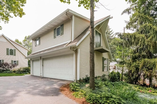 view of side of property featuring a garage