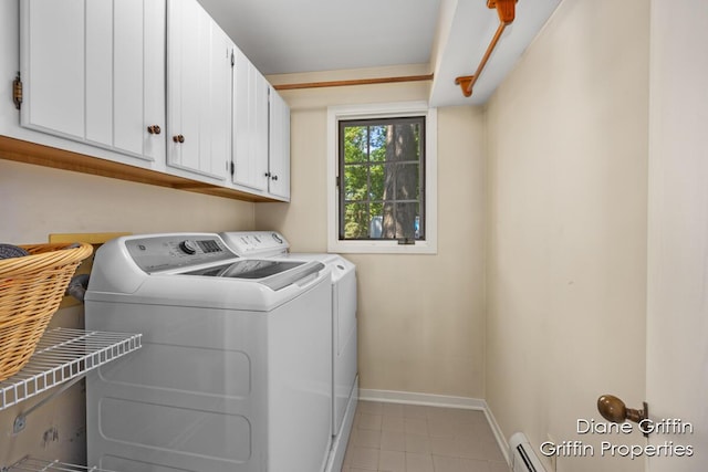 laundry area with cabinets, separate washer and dryer, and baseboard heating