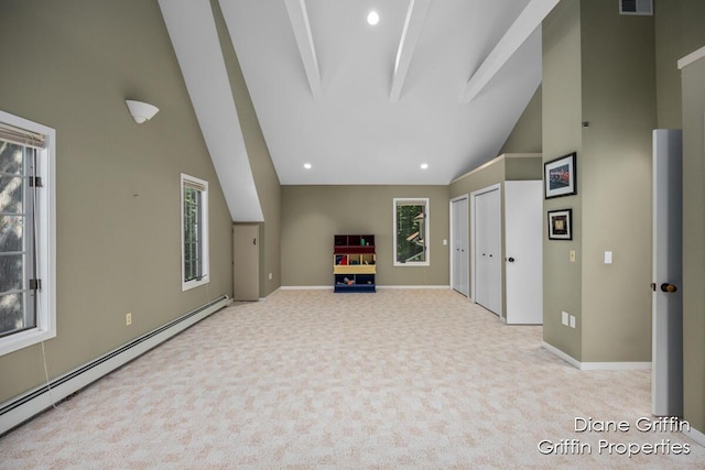 interior space with light colored carpet and baseboard heating