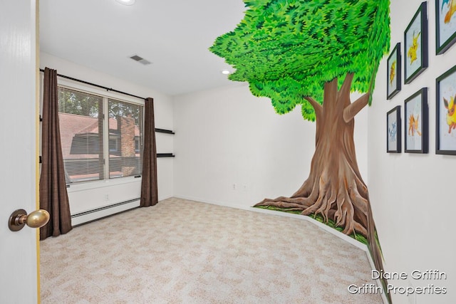 carpeted spare room featuring baseboard heating