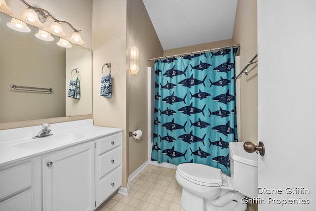 bathroom featuring vanity, toilet, and walk in shower