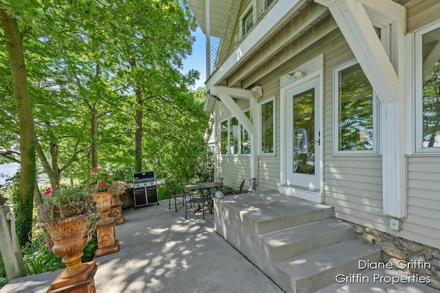 view of patio featuring a grill