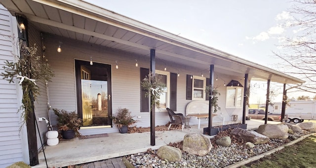 doorway to property featuring a porch