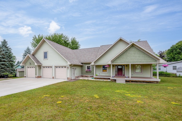 view of front facade featuring a garage, a front yard, and a porch