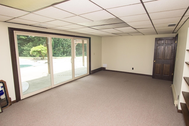 unfurnished living room with carpet and a drop ceiling