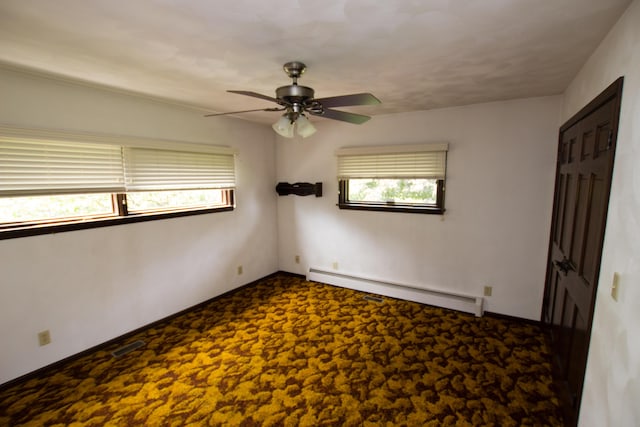 empty room with ceiling fan, a baseboard radiator, and carpet