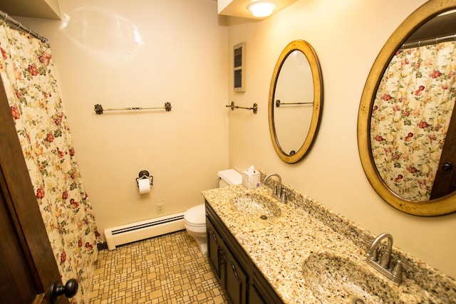 bathroom with vanity, tile patterned floors, baseboard heating, and toilet