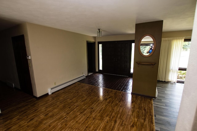 foyer featuring dark hardwood / wood-style flooring and a baseboard heating unit