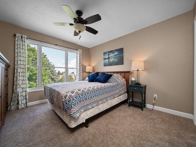 bedroom featuring carpet and ceiling fan