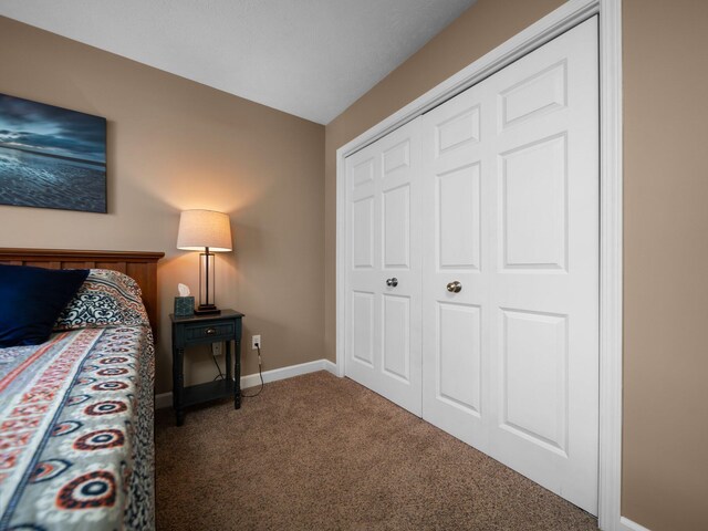 carpeted bedroom featuring a closet