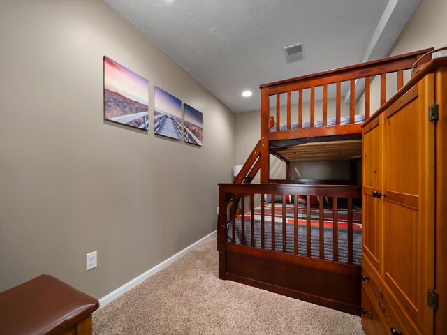 bedroom featuring light colored carpet