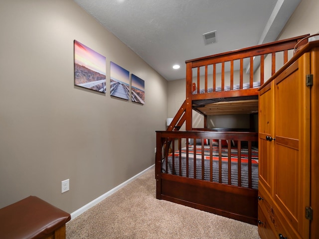 bedroom featuring recessed lighting, baseboards, and carpet