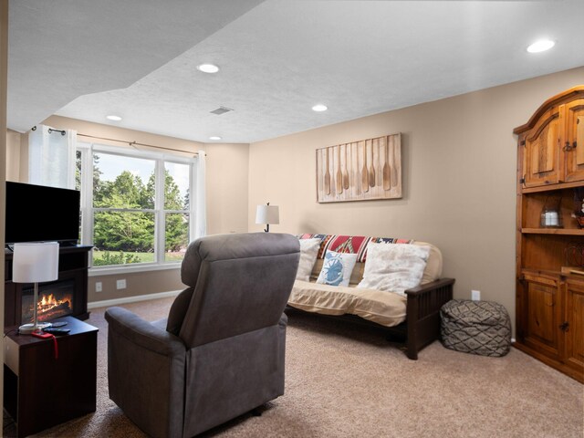 bedroom featuring a textured ceiling and carpet