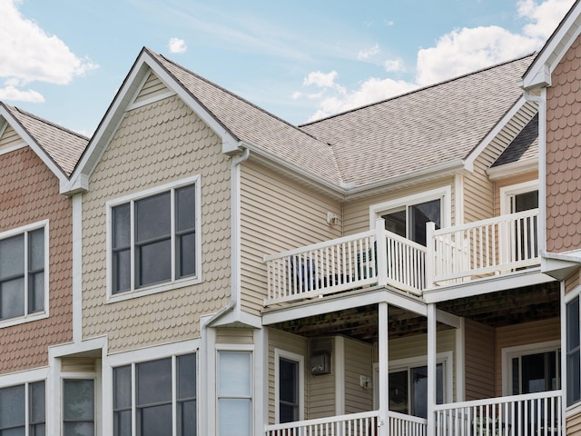 view of property exterior featuring roof with shingles