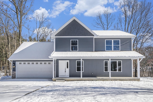 view of front property with covered porch and a garage