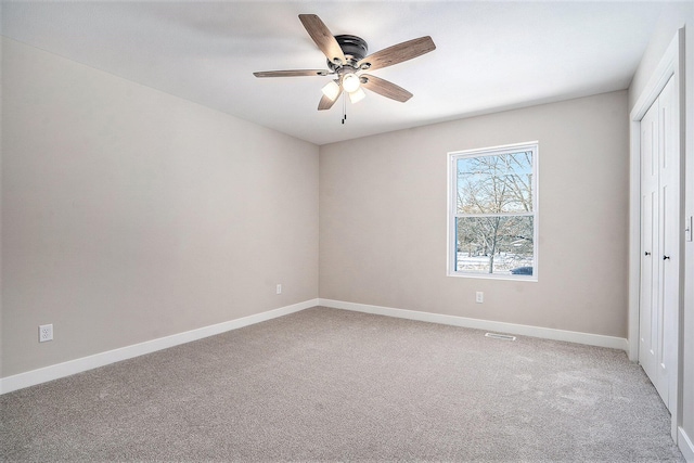 unfurnished bedroom with ceiling fan and carpet floors