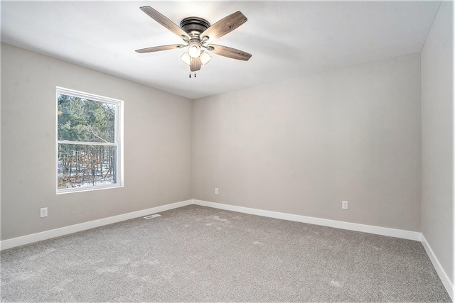 carpeted empty room with ceiling fan