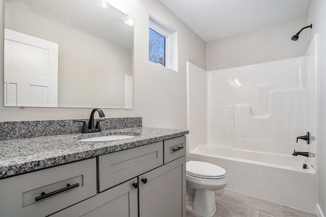 full bathroom with tile patterned floors, vanity, shower / bathtub combination, and toilet