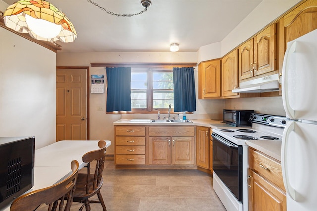 kitchen with sink, white appliances, and light tile patterned floors