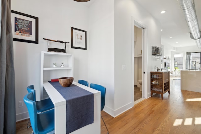 corridor featuring hardwood / wood-style flooring