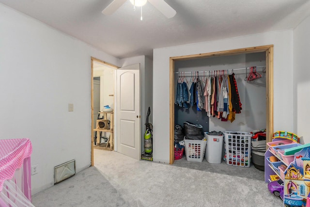 bedroom with carpet, a closet, and ceiling fan