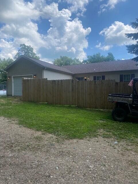 view of yard with a garage