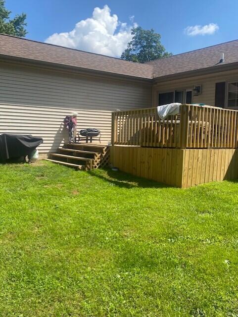 rear view of property with a lawn