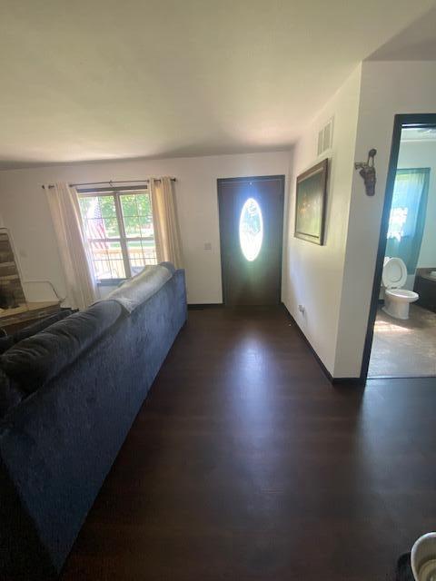 foyer entrance with dark hardwood / wood-style floors