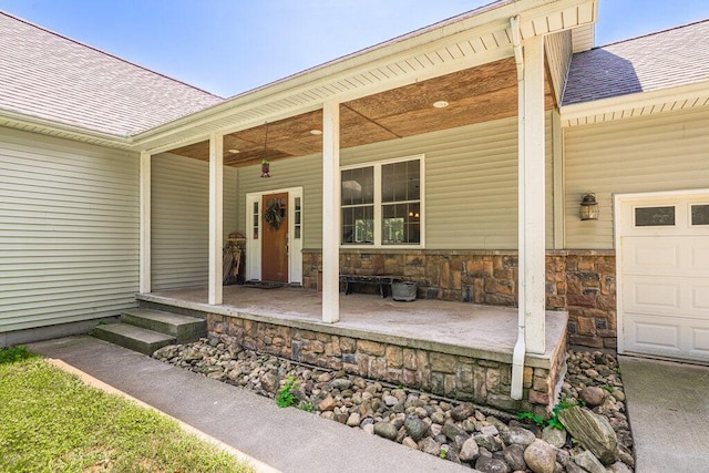 doorway to property with a garage