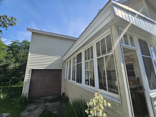 view of side of property featuring a garage