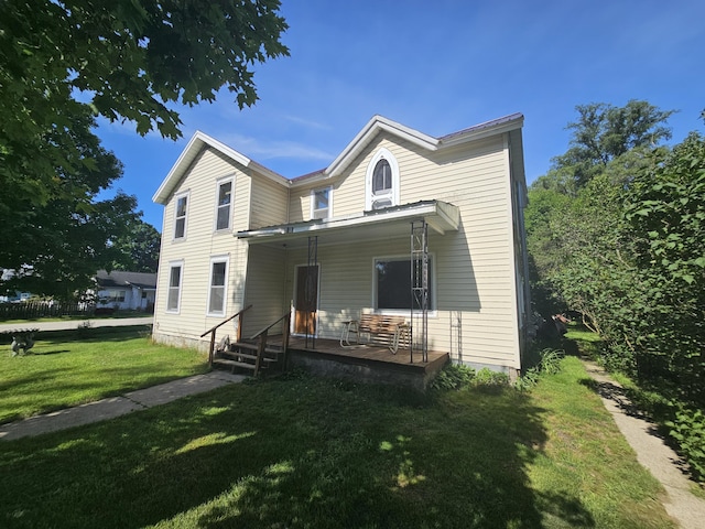 view of front of property with a porch and a front yard