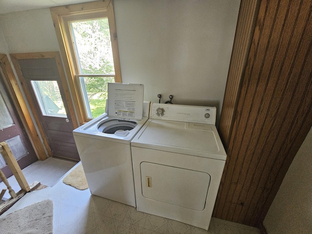 washroom with independent washer and dryer