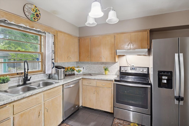 kitchen featuring tasteful backsplash, appliances with stainless steel finishes, sink, and light brown cabinetry