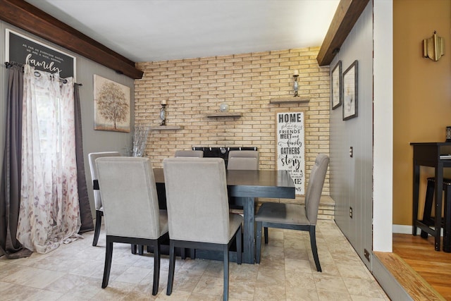 dining space with brick wall