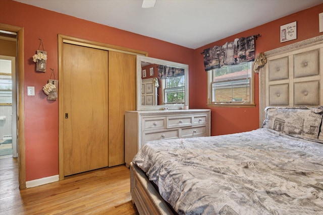 bedroom featuring light hardwood / wood-style flooring and a closet