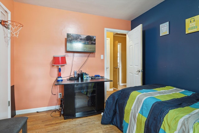 bedroom with light hardwood / wood-style floors