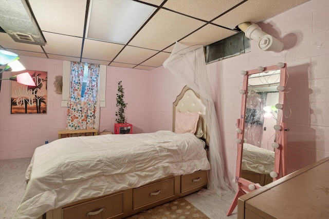 bedroom with a paneled ceiling