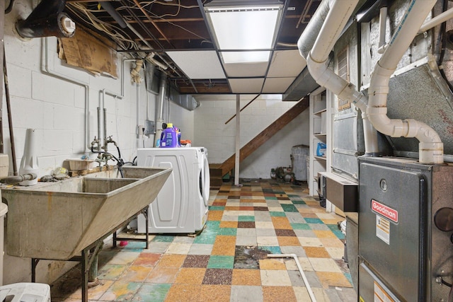 basement featuring washer / clothes dryer and sink