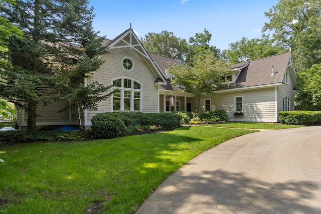 rear view of house with a lawn