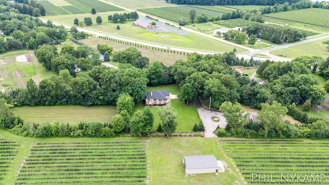 birds eye view of property with a rural view