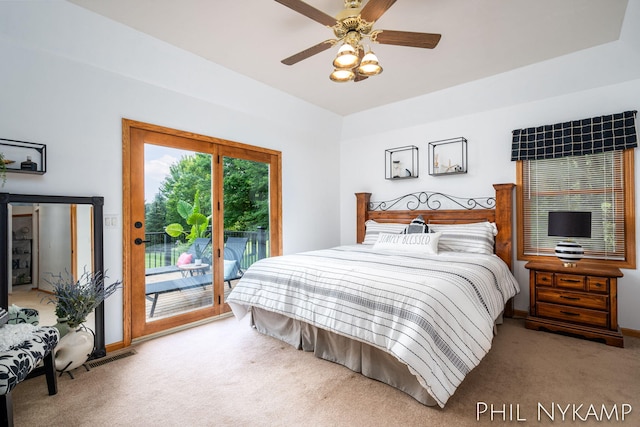 carpeted bedroom featuring ceiling fan and access to exterior