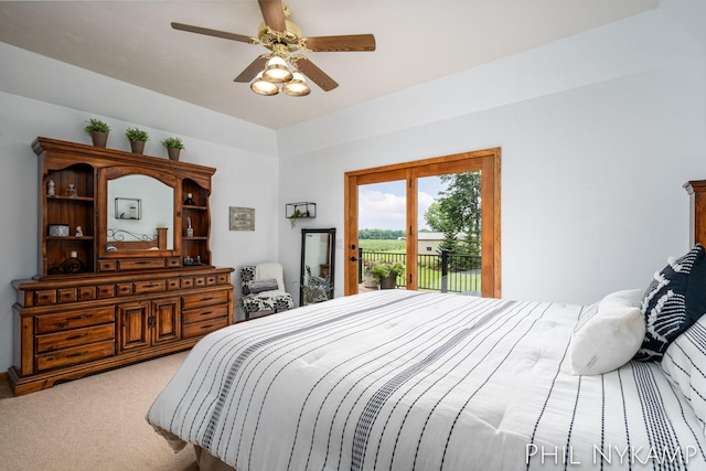 carpeted bedroom featuring ceiling fan and access to outside