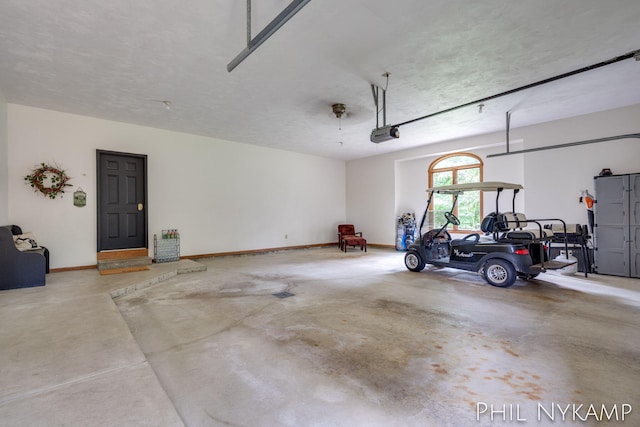 garage featuring a garage door opener