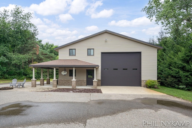 view of front facade with a garage and a porch