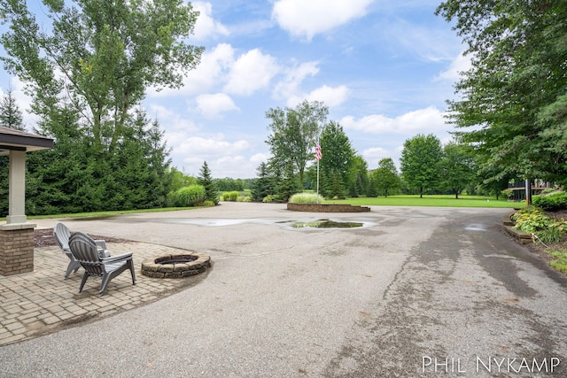 exterior space featuring an outdoor fire pit